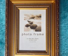 Gold-colored photo frame.
