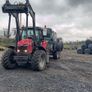 Hauling bales and stacking Image 2