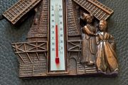 Copper windmill temperature plack.