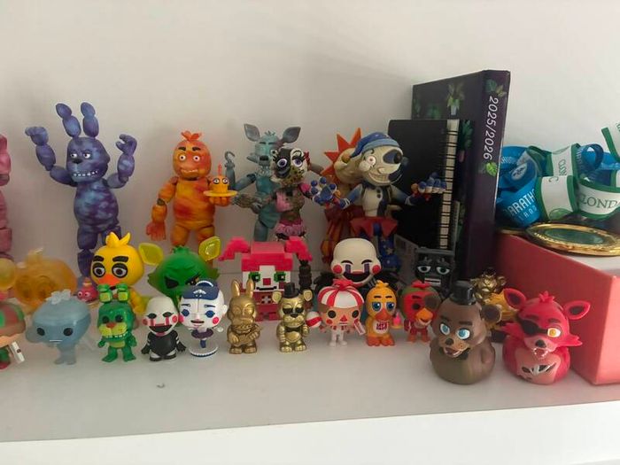 Five Nights at Freddys plushies and dragon figures