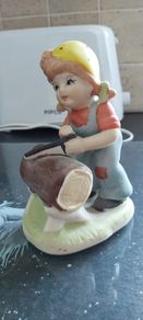 Vintage Little Girl with saw Ceramic Figurine