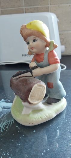 Vintage Little Girl with saw Ceramic Figurine