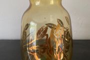 Vintage glass vase with gold decorations.