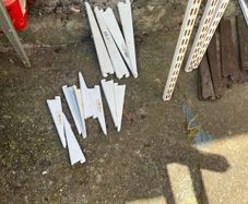 Adjustable shelving rails and brackets