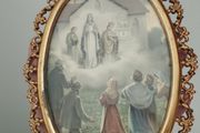An antique-style painting set in an ornate, gold-toned frame.