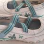 New white shoes with butterfly design Image 2