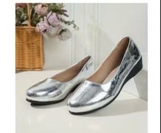Brand new Low Silver Wedge. Size 6.5