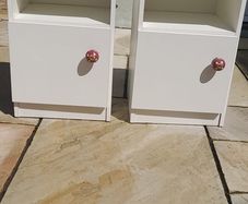 A pair of vintage wooden beside lockers