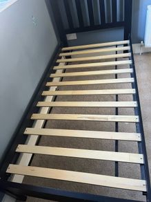 1 Black wooden framed single bed