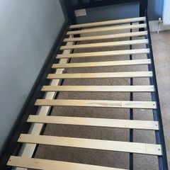 1 Black wooden framed single bed