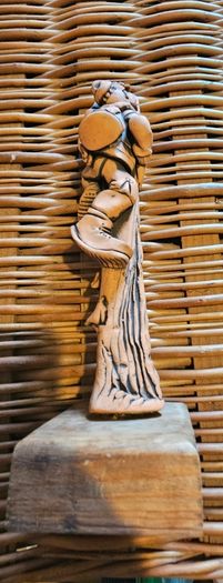 A terracotta sculpture of a hill walker by Irish artist Ronnie Fulton.