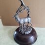 This magnificent stag ornament perfectly captures the proud stance of the  and will make an eye-catching focal point in any room SET ON DARK WOOD DOME. Image 2