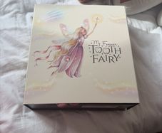 Girls tooth fairy doll and book
