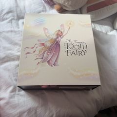 Girls tooth fairy doll and book