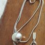 BEN DE LISI long necklace with a ball pendant. Image 3