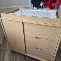 Kub Madera baby changing table and storage.
