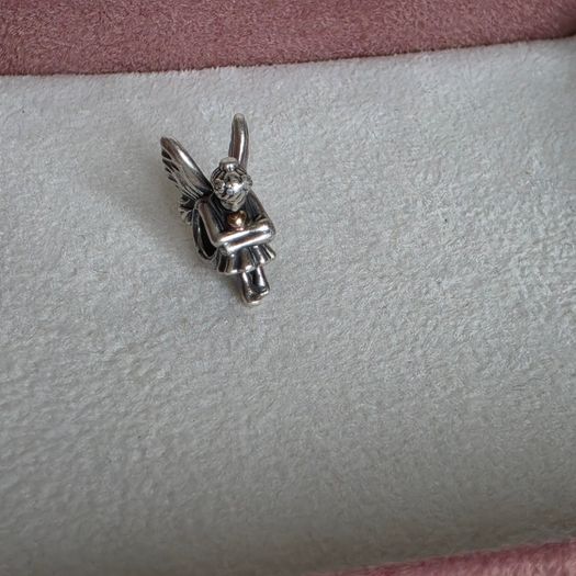 Pandora sitting pixie charm with 14k yellow gold heart  very good condition hallmarked