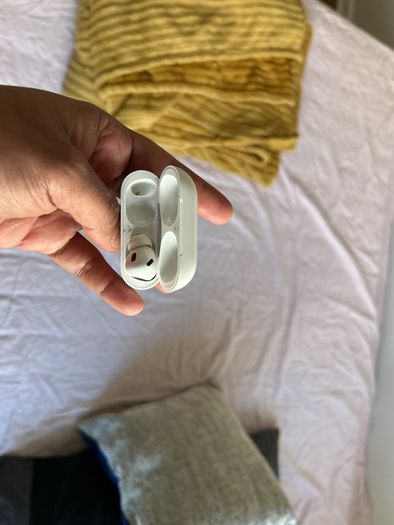 AirPods Pro right hearing piece and case.