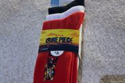 Set of 3 pairs of licensed One Piece socks featuring Straw Hat Pirates graphics.