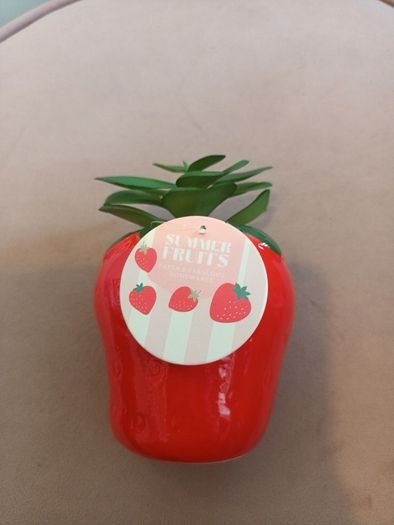 Faux succulent in strawberry vase