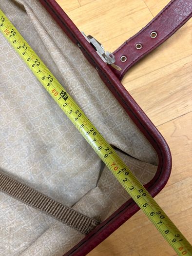Vintage burgundy faux-leather suitcase