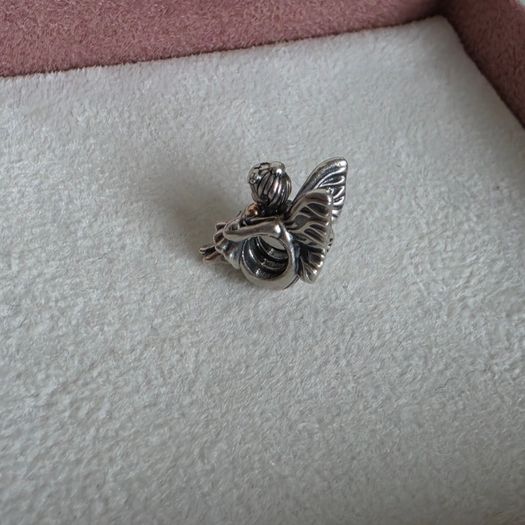 Pandora sitting pixie charm with 14k yellow gold heart  very good condition hallmarked