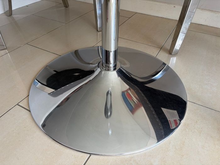 Glass table with velvet studded chairs
