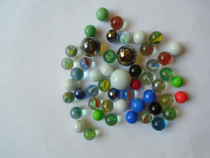 Jar of assorted marbles, Marbles.