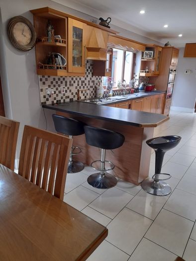 Solid oak kitchen shaker style American style samsung fridge freezer and electric hob.