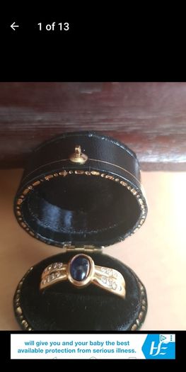 18 ct gold ring with Sapphire stone and 16 brilliant cut diamonds