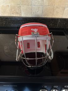 Red Gola hurling helmet