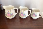Vintage Edwardian Lady in flower garden set of three graduating  water jugs
