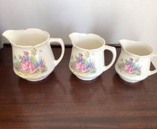 Vintage Edwardian Lady in flower garden set of three graduating  water jugs