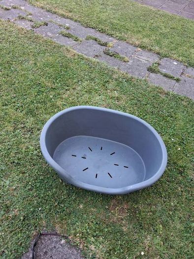 Small plastic dog bed.