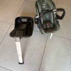 This is an UPPAbaby Mesa i-Size Infant Car Seat in a green-toned fabric.