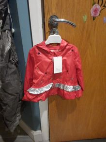 red and silver baby jacket