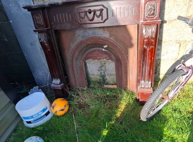 Cast iron fire inset and mahogany fireplace