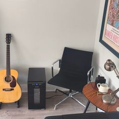 Sleek black mini fridge wine cooler