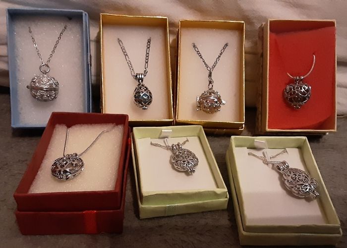 selection of homemade white metal necklaces