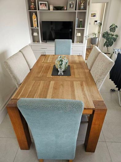 dining table and chairs oak table very good quality and solid chairs are as new  o marks or stains