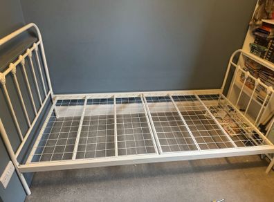 white metal frame bed
