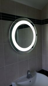 Bathroom light with demister