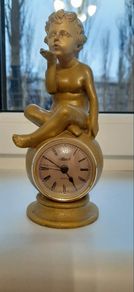 Antique clock angel helmet