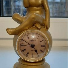 Antique clock angel helmet