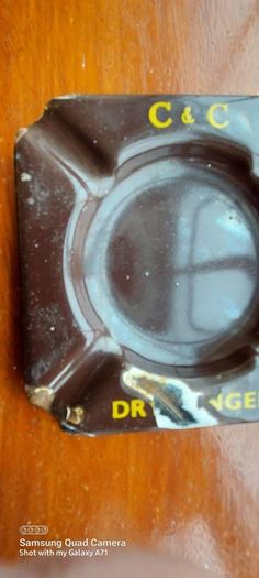 C & C Dry Ginger "ale" enamel metal ashtray ,dark brown,  very old vintage advertising ashtray, hard to come by ,collectors item,used condition  see pictures