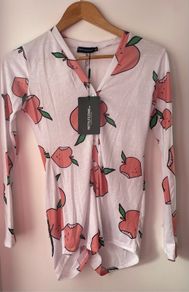 Prettylittlething white peachy print romper size xs