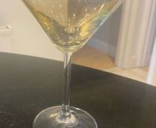 Set of four amber and plain glass martini or cocktail glasses