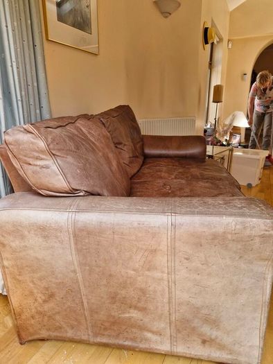 brown leather sofa and arm chair