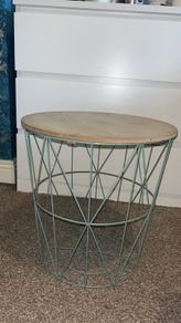 Side table with storage basket