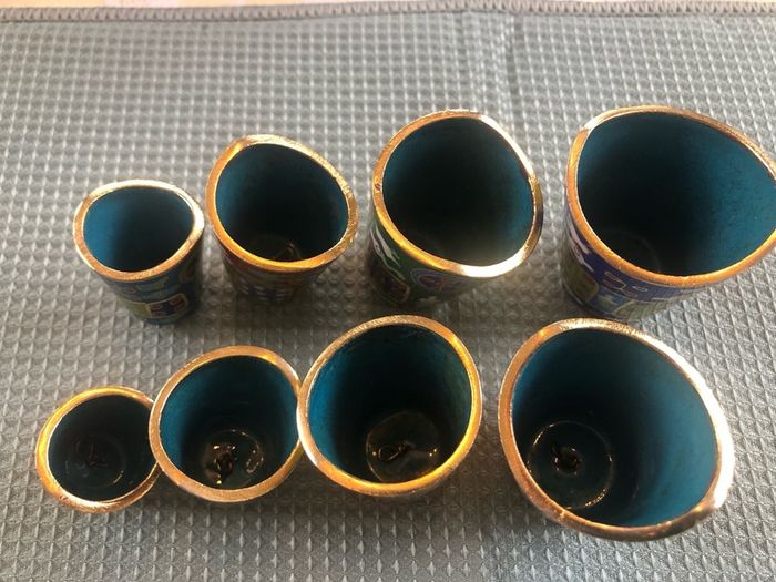 Enamel cloisonne graduated bells on wooden stand